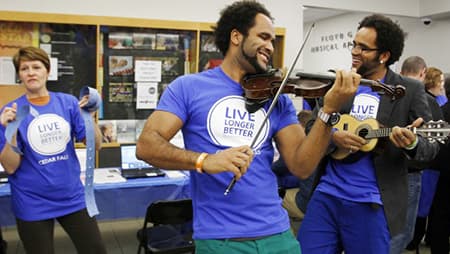 Three friends playing musical instruments