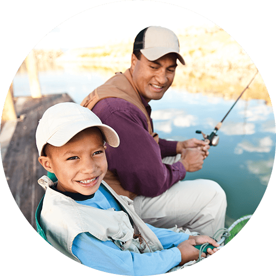 Father and son fishing on the dock